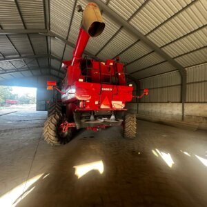 Alternative view of Case 2399 Stroper / Combine Harvester with John Deere 615P Pick Up